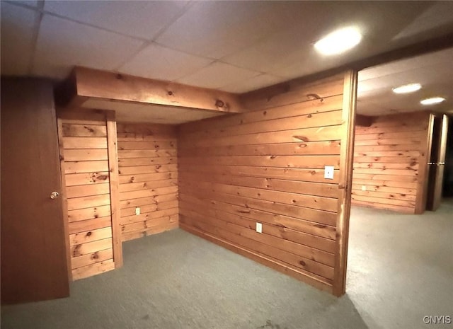 bonus room with wooden walls and carpet floors