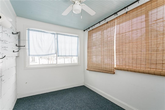 carpeted empty room with ceiling fan