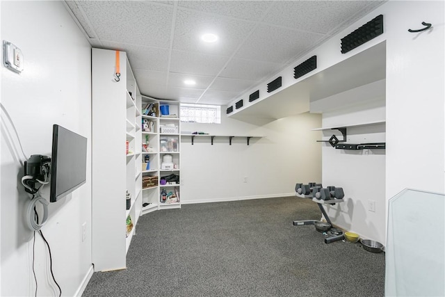 workout room featuring a paneled ceiling