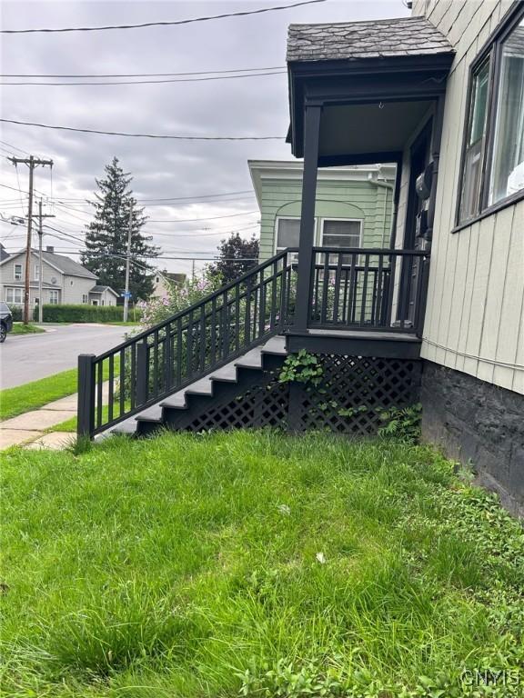 view of home's exterior with a lawn