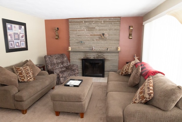 living room with a tiled fireplace