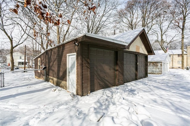 view of snow covered garage