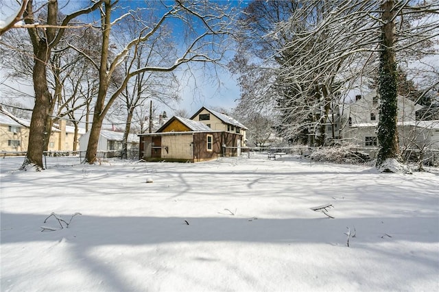 view of yard layered in snow