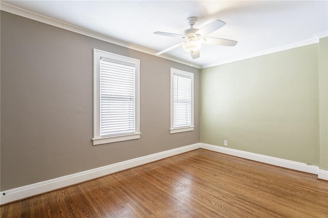 unfurnished room featuring hardwood / wood-style floors, crown molding, and ceiling fan