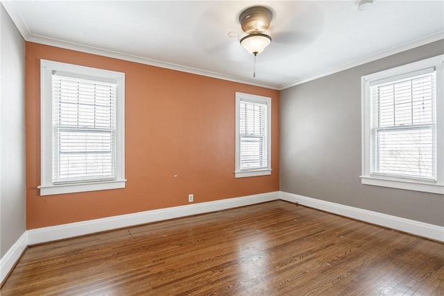 unfurnished room featuring ceiling fan, ornamental molding, and wood-type flooring