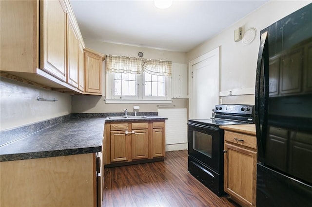 kitchen featuring sink, dark wood-type flooring, and black appliances