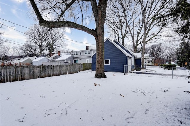 view of yard covered in snow