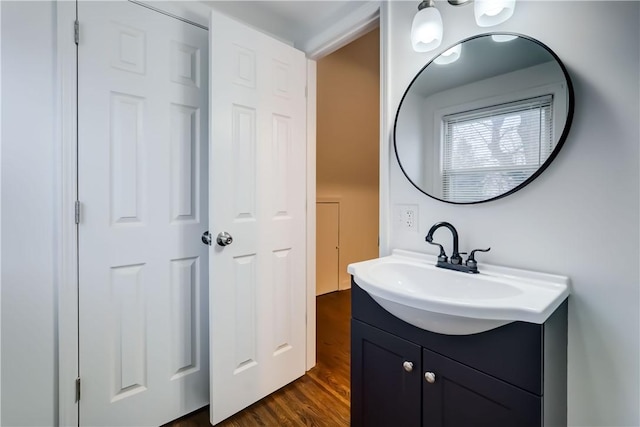 bathroom with vanity and wood-type flooring