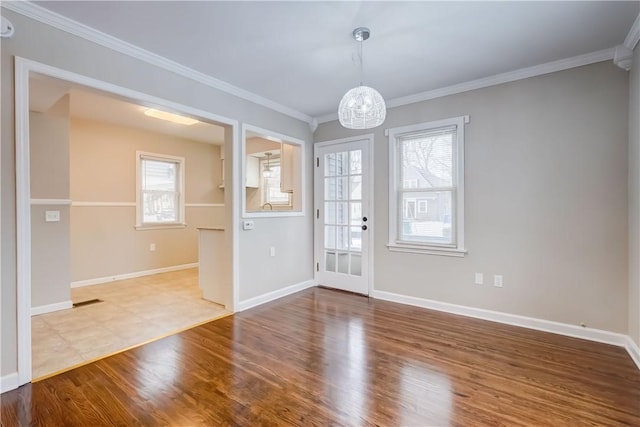 interior space featuring ornamental molding and wood-type flooring