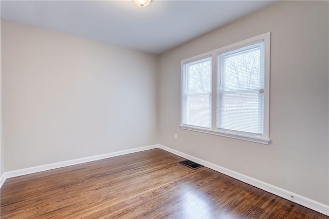 empty room featuring hardwood / wood-style floors