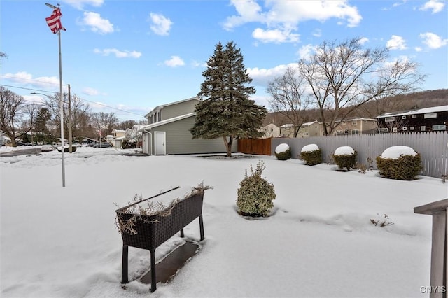 view of yard covered in snow