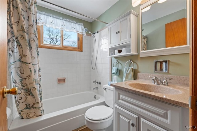 full bathroom featuring vanity, shower / bathtub combination with curtain, and toilet