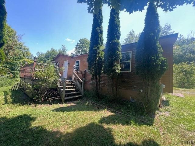 view of yard with a wooden deck