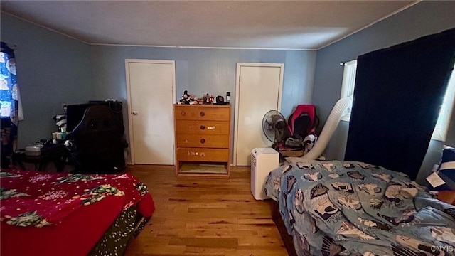 bedroom with light wood-type flooring