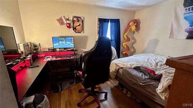 bedroom featuring hardwood / wood-style flooring