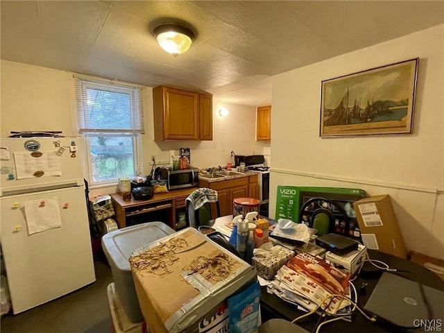 kitchen featuring white appliances and sink