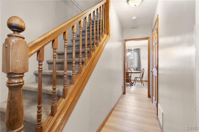 stairs with wood-type flooring