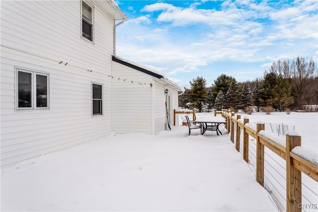 view of yard layered in snow