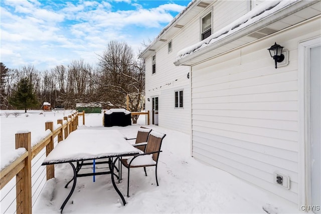 view of snow covered patio