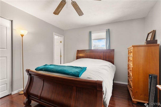 bedroom featuring dark hardwood / wood-style floors and ceiling fan