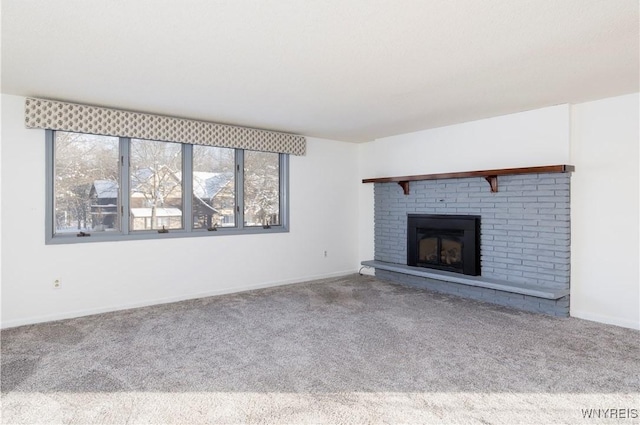 unfurnished living room featuring carpet and a fireplace