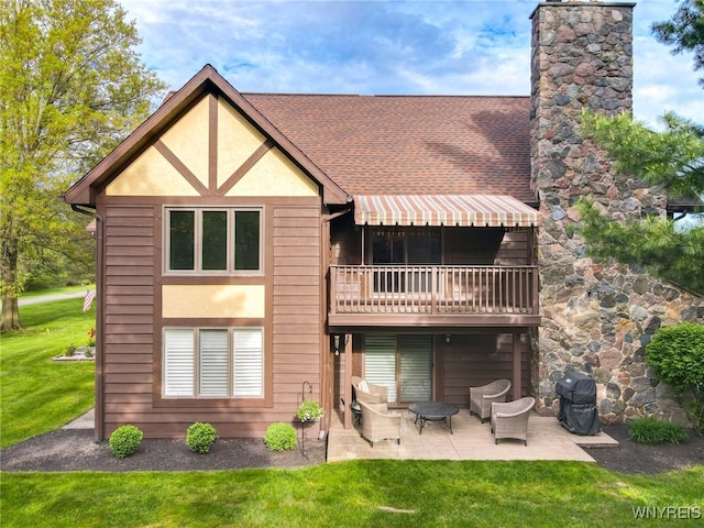 5293E Chestnut Ridge Rd Unit E, Orchard Park, NY 14127 - back of house featuring a yard, a chimney, a patio area, and stucco siding