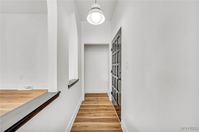 corridor featuring light hardwood / wood-style flooring