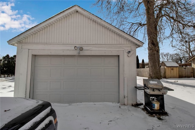 view of snow covered garage