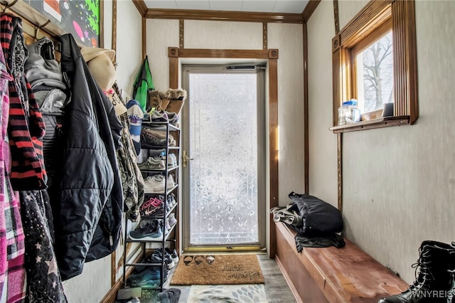 doorway featuring hardwood / wood-style flooring and ornamental molding