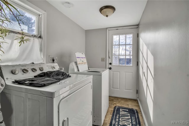 washroom with washing machine and clothes dryer