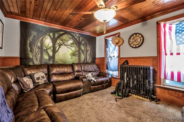 living room featuring crown molding, radiator heating unit, wooden ceiling, and wood walls