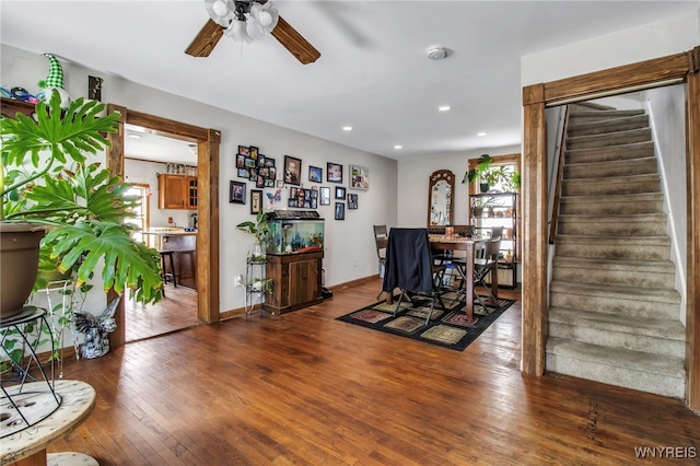 dining room with hardwood / wood-style flooring and ceiling fan