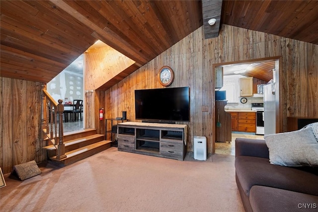 carpeted living room with lofted ceiling, wood ceiling, and wooden walls