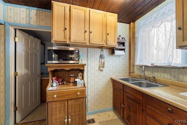 kitchen with wood ceiling and sink