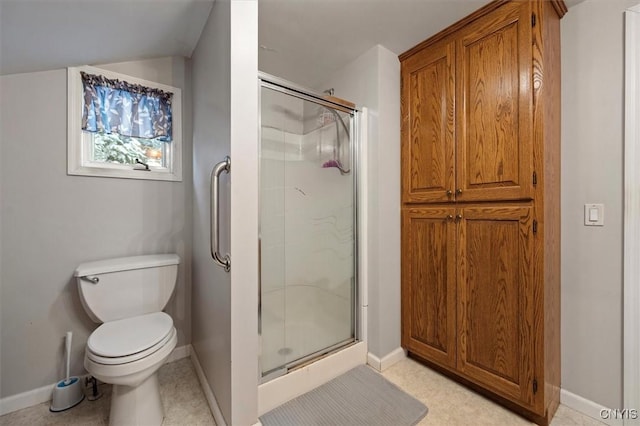 bathroom featuring toilet and an enclosed shower