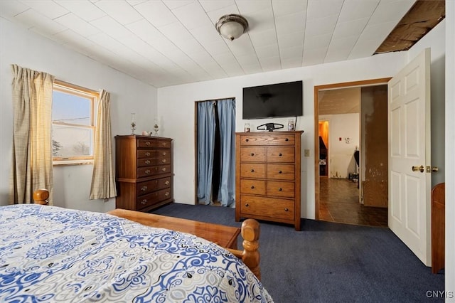 bedroom featuring dark carpet