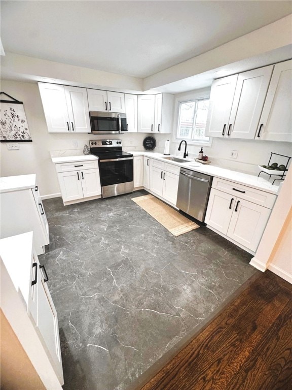 kitchen featuring white cabinetry, sink, and stainless steel appliances