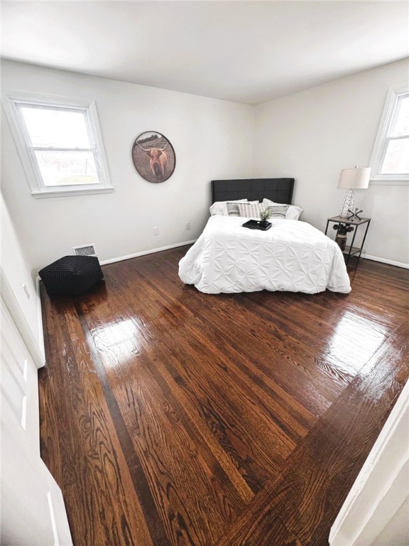 bedroom featuring dark wood-type flooring