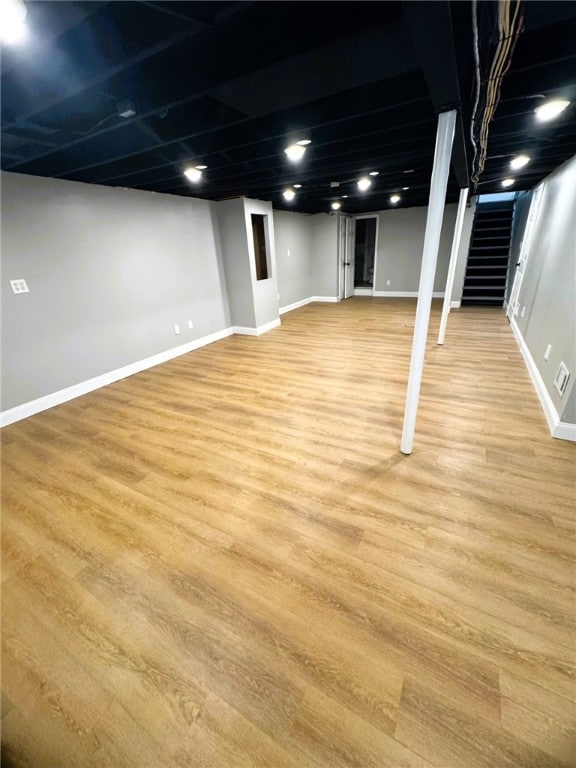 basement featuring light hardwood / wood-style floors