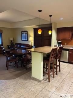 dining room featuring light tile patterned flooring