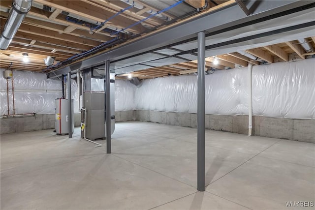 basement with water heater and heating unit