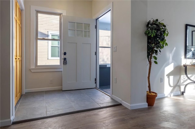 foyer entrance with plenty of natural light and hardwood / wood-style floors