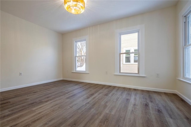 unfurnished room featuring dark wood-type flooring