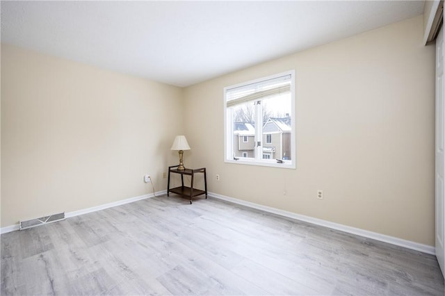 unfurnished room featuring light hardwood / wood-style flooring