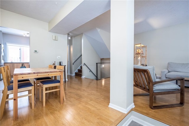 dining space with light wood-type flooring