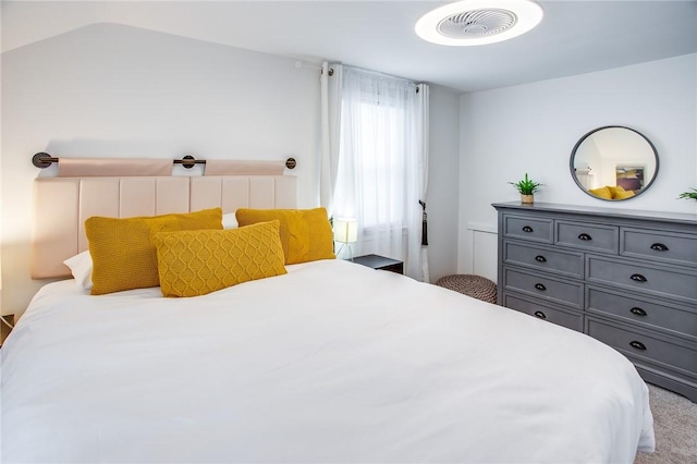 bedroom with vaulted ceiling