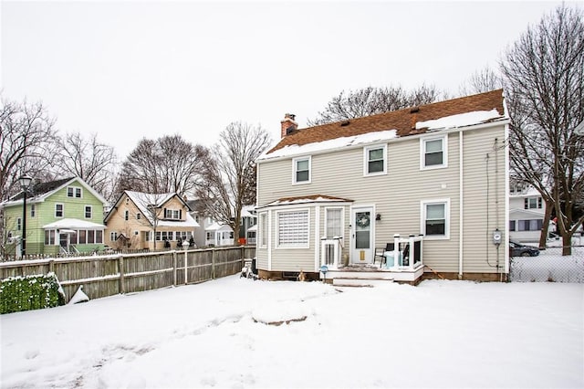 view of snow covered property