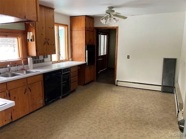 kitchen with sink, light carpet, a baseboard heating unit, ceiling fan, and black appliances