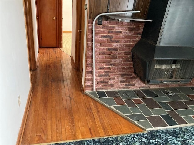 hallway with dark hardwood / wood-style flooring