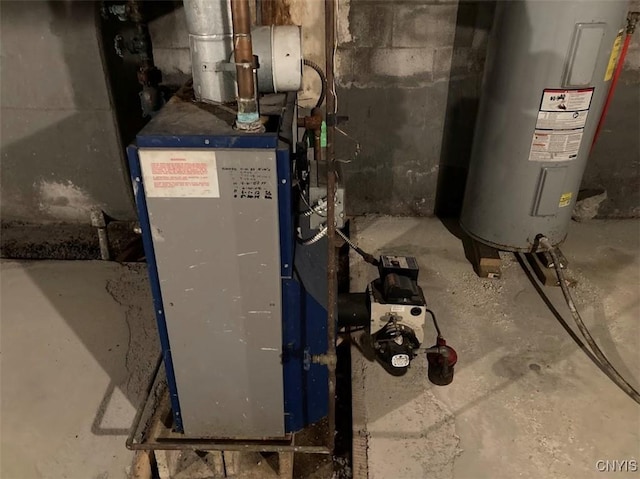 utility room featuring water heater